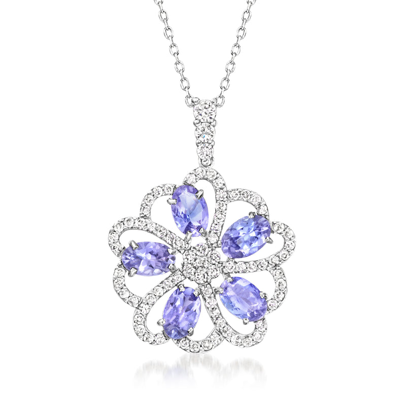 White gold flower pendant necklace with oval purple gemstones and diamond accents
