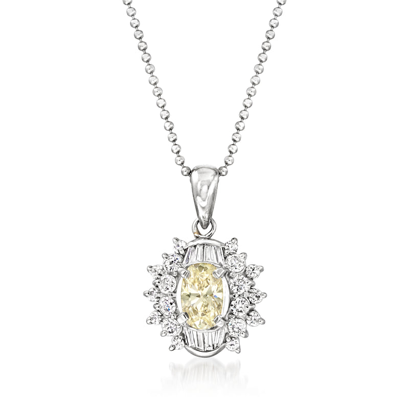 Vintage diamond pendant necklace with round yellow center and white diamond halo, platinum