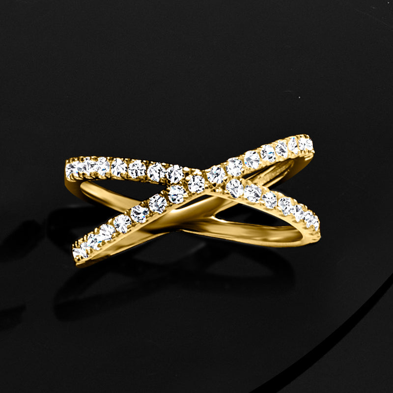 Crisscross diamond ring angled view, sparkling round stones on gold over sterling