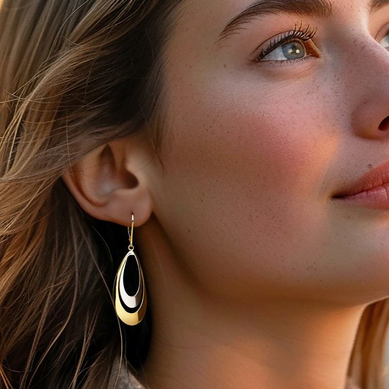 Gold teardrop leverback earrings with white enamel in oval center