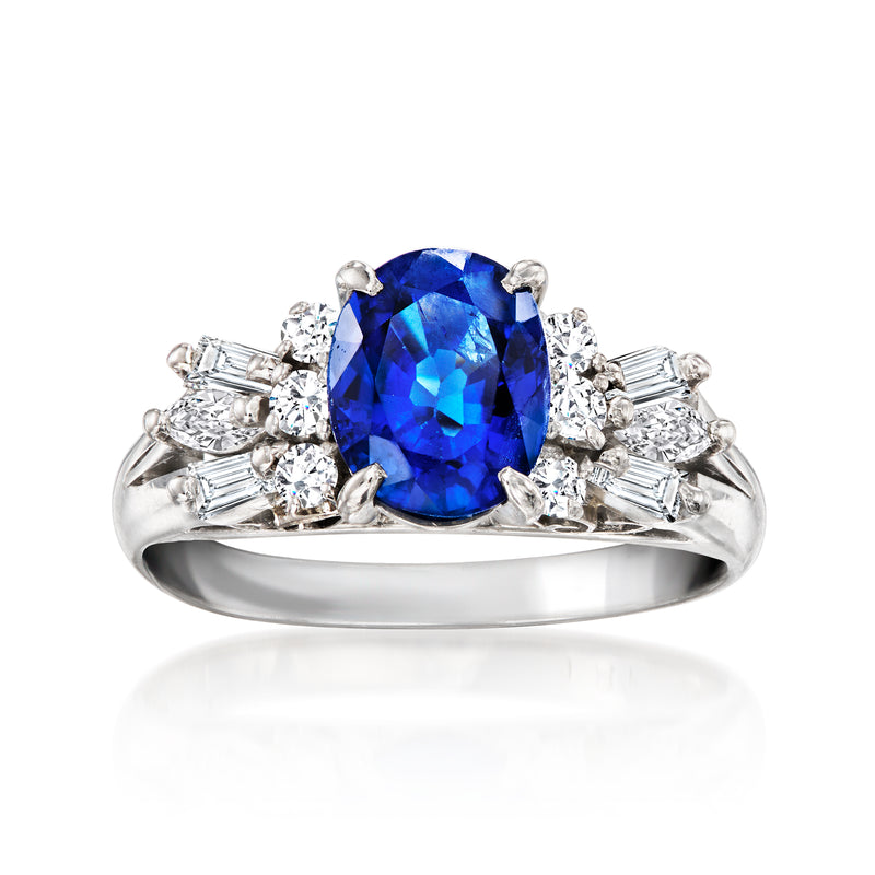 Platinum vintage sapphire and diamond ring with large oval blue gemstone center