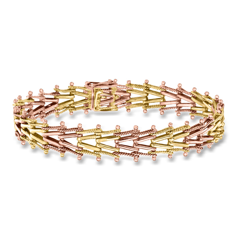 Two-tone gold chevron-style bracelet with bead accents and clasp