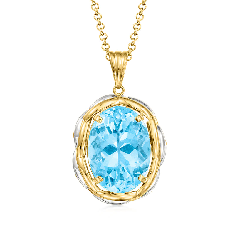 Vintage topaz pendant necklace with Swiss blue oval gemstone in gold and platinum bezel