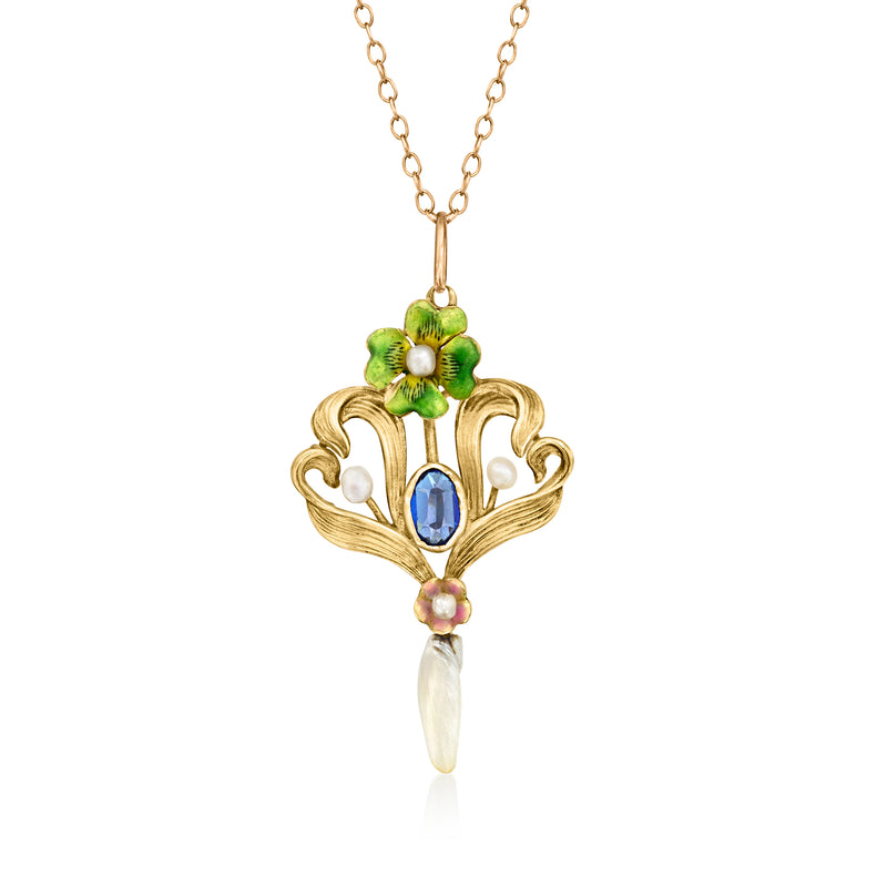 Vintage gold pendant necklace with green enamel flower, blue oval stone, and pearl drop