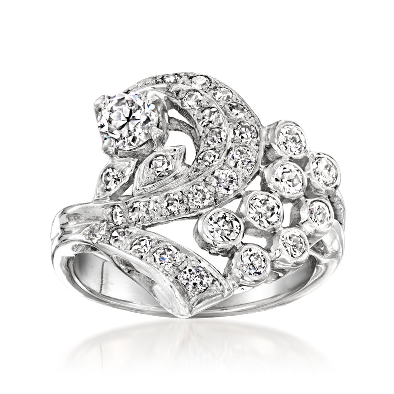Platinum diamond swirl ring with round and pave-set stones