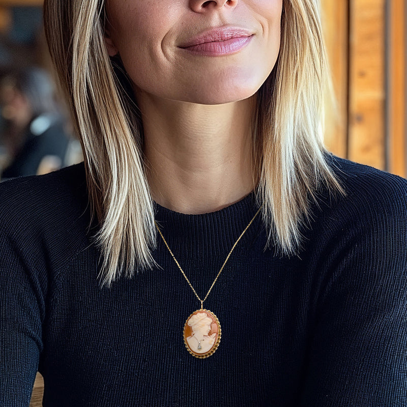 Cameo pendant necklace with oval shell portrait in 14kt yellow gold and diamond accents