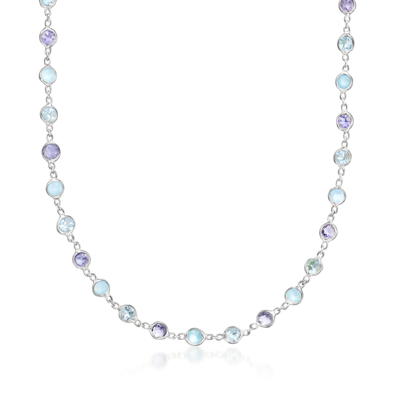 Sterling silver bezel-set necklace with oval blue and purple gemstones, flexible chain.