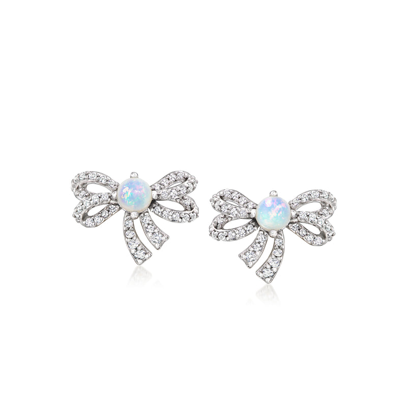Sterling silver bow stud earrings with white opal center and clear stone accents