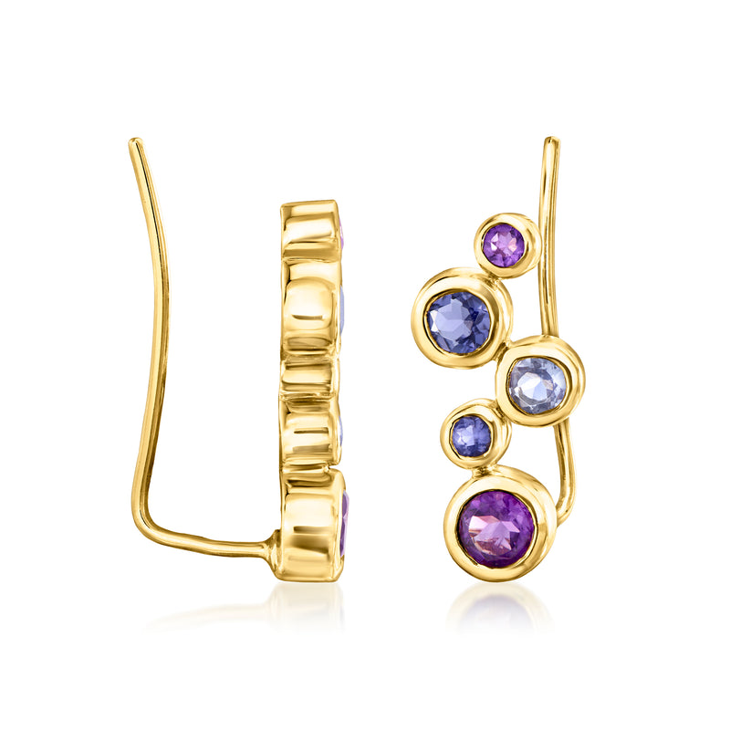 Gold ear climber earrings shown from the side with bezel-set purple and blue round stones