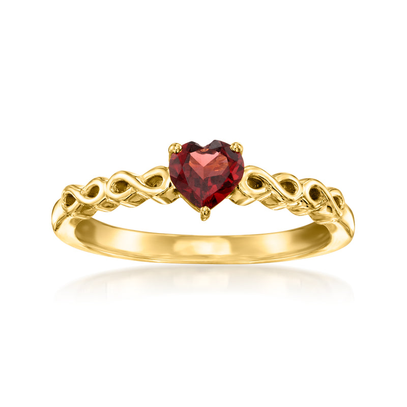 Heart-shaped garnet ring with gold-toned setting and twisted band