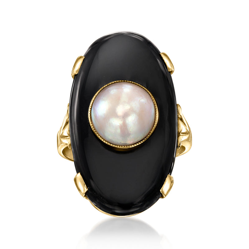 Oval black onyx ring with iridescent pearl bezel in 14k yellow gold