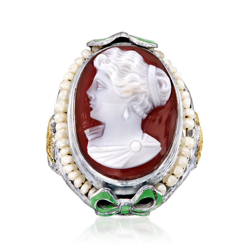 Vintage cameo ring with red shell oval, seed pearls, and green enamel bow setting