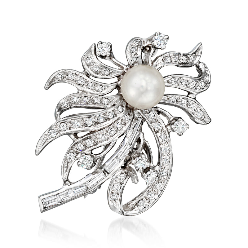 Pearl and diamond floral pin in white gold with ornate swirl settings