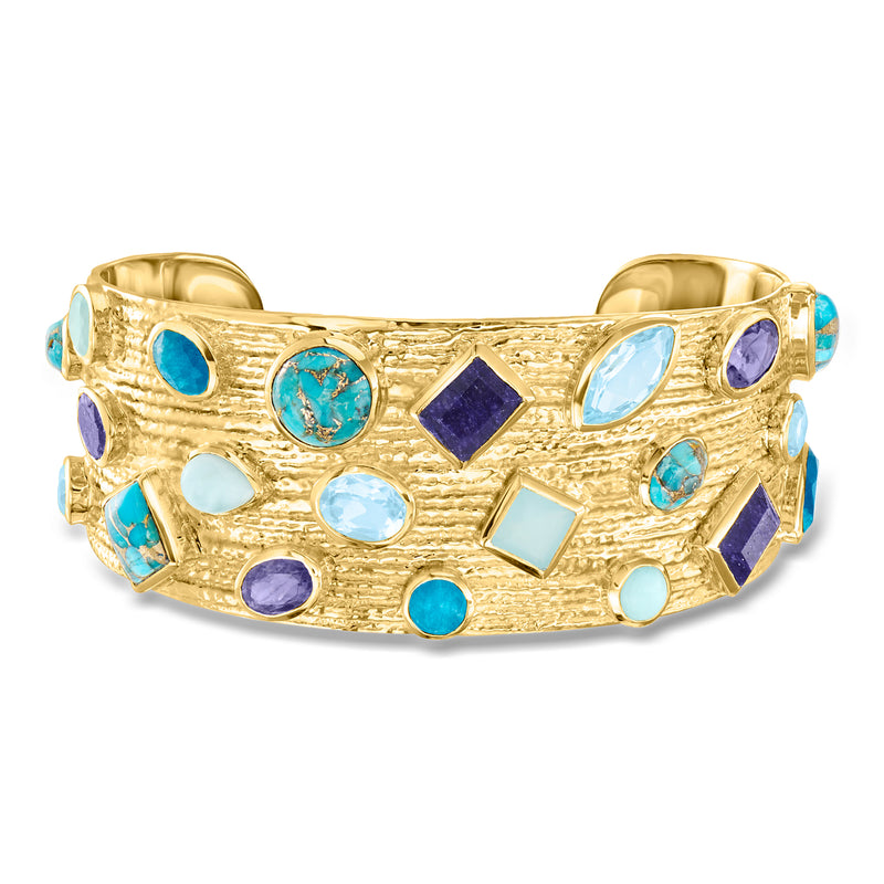 Gold cuff bracelet with blue and purple gemstone inlays