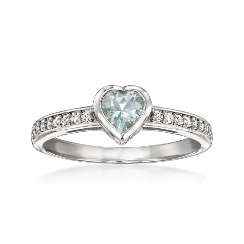 Sterling silver heart ring with aquamarine-colored center and white zircon pave band