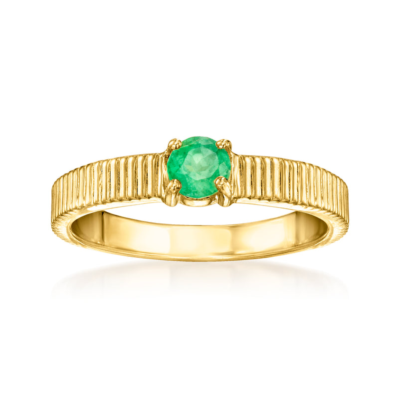 Emerald ridged ring in gold-tone with oval green gemstone center and ridged band