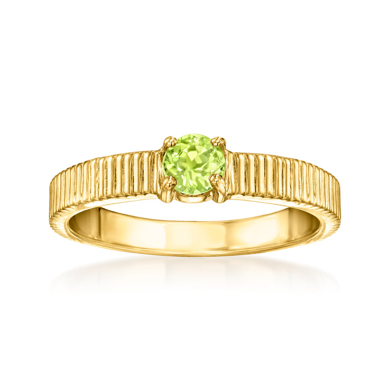Gold-tone ridged ring with oval peridot green gemstone bezel setting