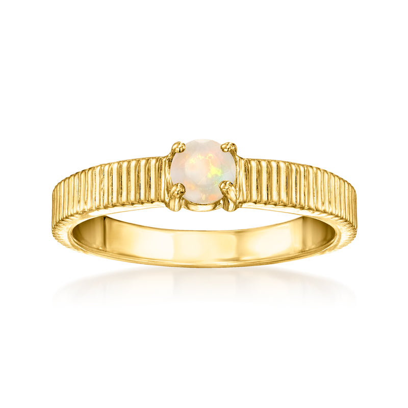 Gold over sterling ring with ridged band and round opal centerpiece