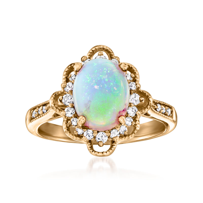 14kt yellow gold oval opal ring with diamond halo and scalloped edges