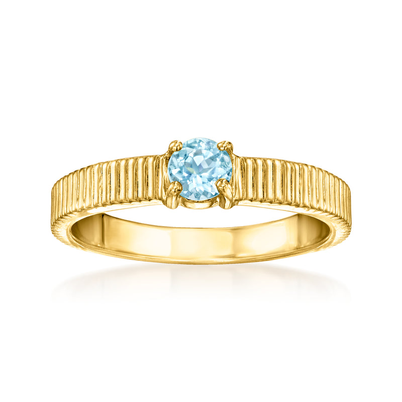 Ribbed 18kt gold over sterling ring with sky blue faceted topaz centerpiece