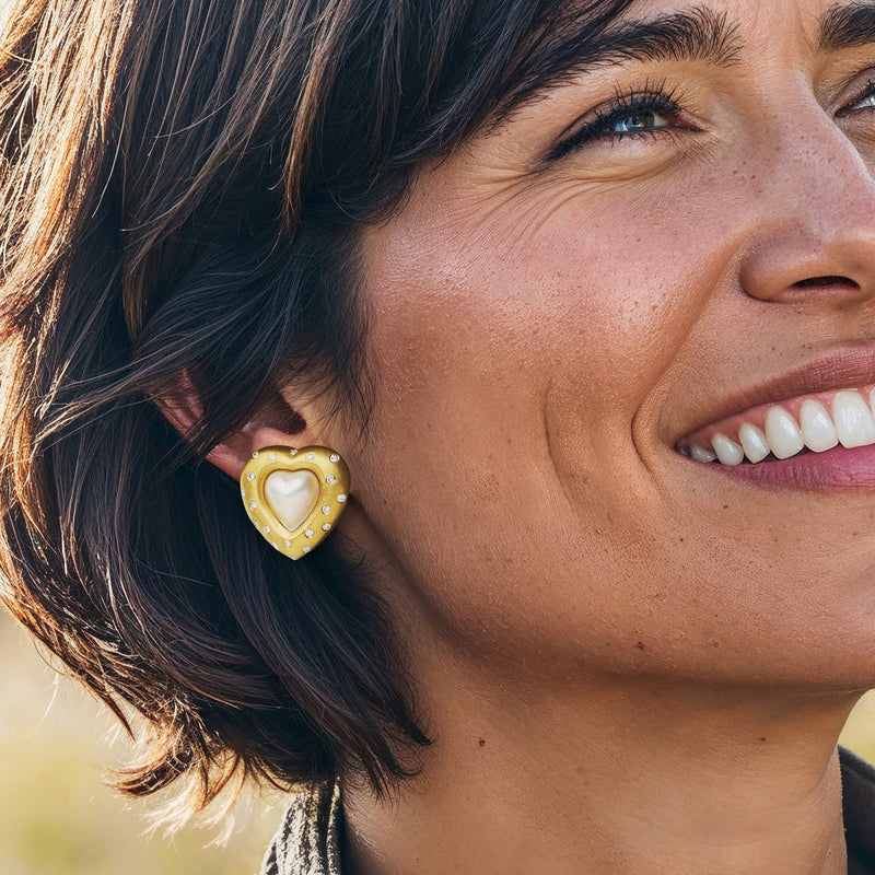Mabe pearl heart earrings on model in 18k yellow gold with diamond halo