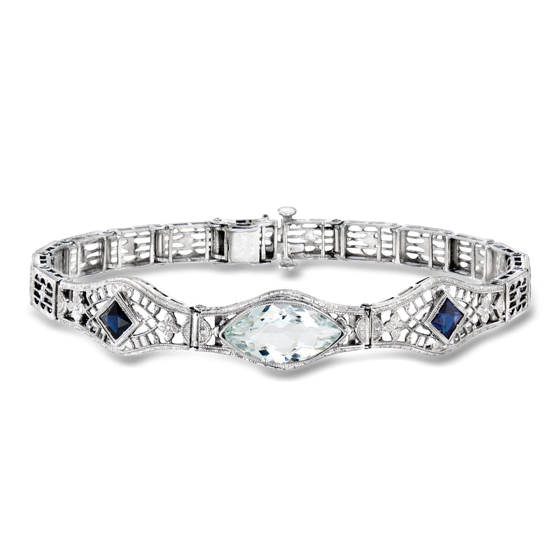 Aquamarine and sapphire filigree bracelet in 14kt white gold, oval center stone.