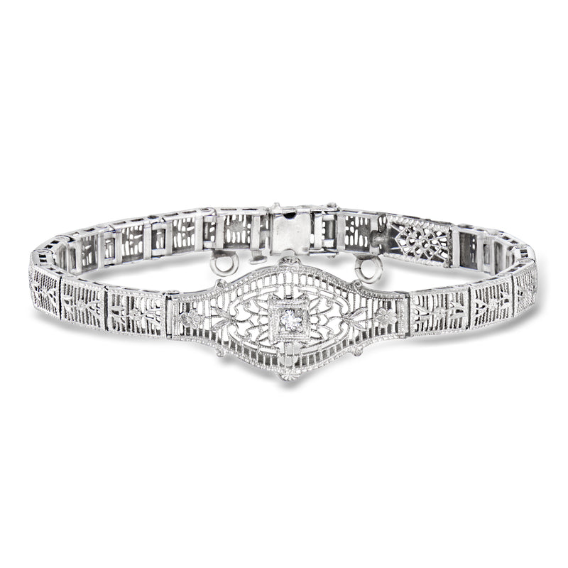 14kt white gold vintage filigree bracelet with central single diamond, openwork links