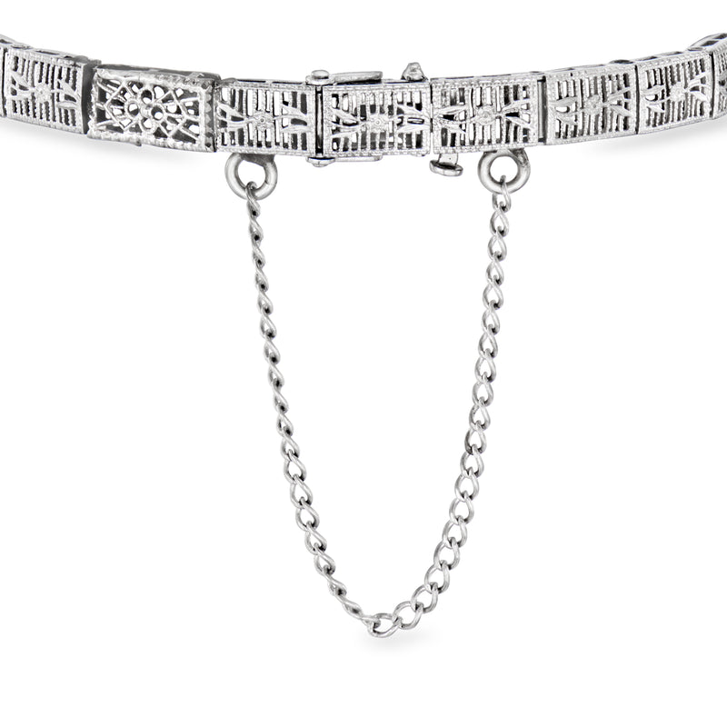 14kt white gold filigree bracelet with dangling chain accents and geometric diamond panel