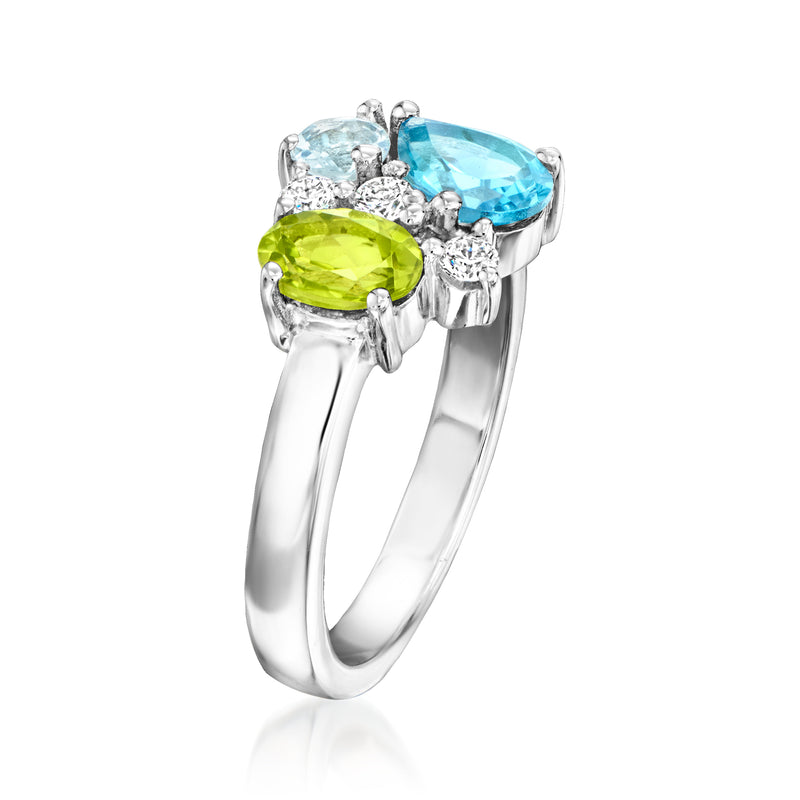 Sterling silver ring with lime peridot and blue aquamarine, framed by lab-grown diamonds.