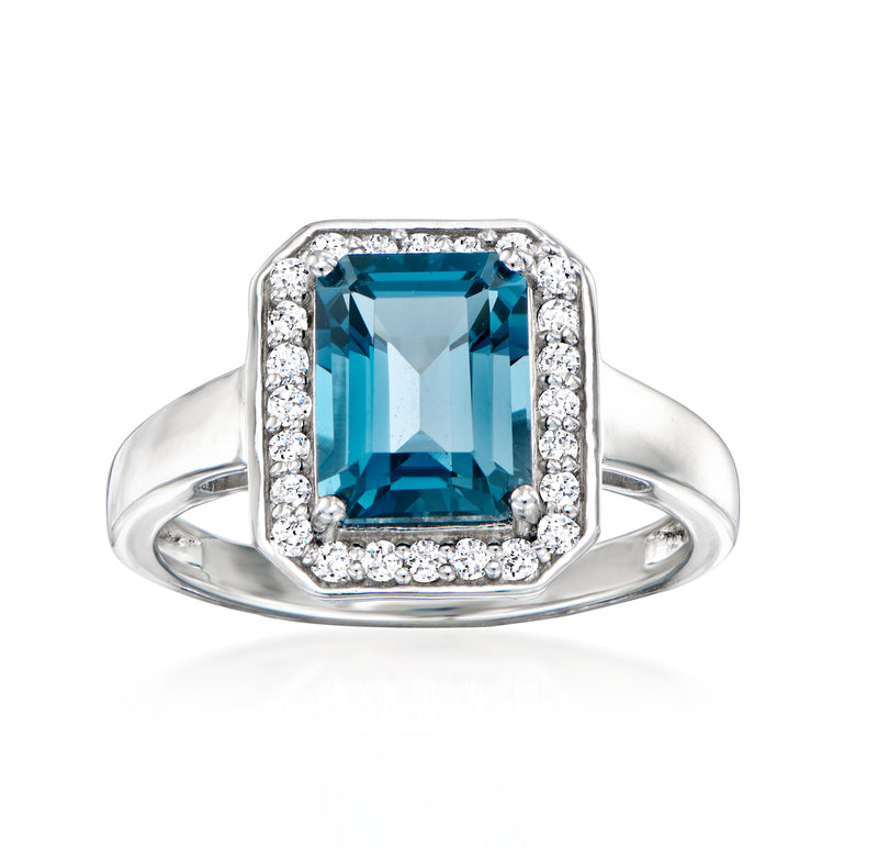 Sterling silver ring with blue topaz center and diamond halo