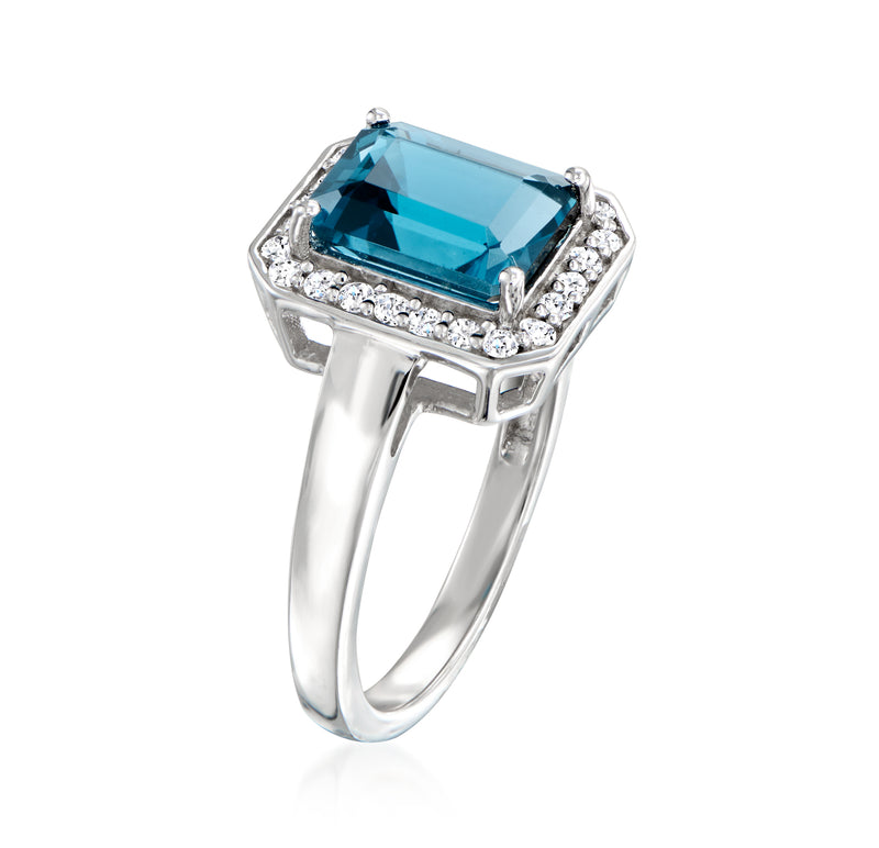 Sterling silver blue topaz ring with rectangular halo and side prongs