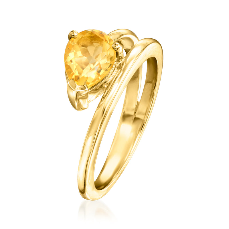 Gold wrap ring with oval citrine gemstone and sculpted open double band
