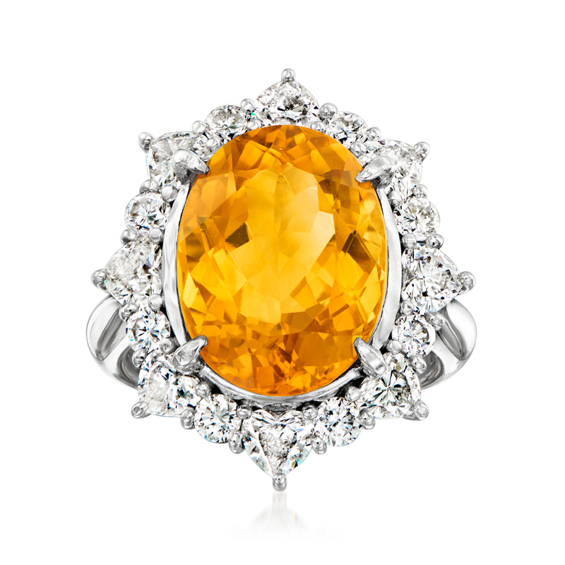 Platinum cocktail ring with large oval citrine and diamond halo cluster