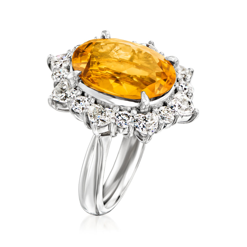 Platinum cocktail ring with oval citrine center and prong-set diamond side stones