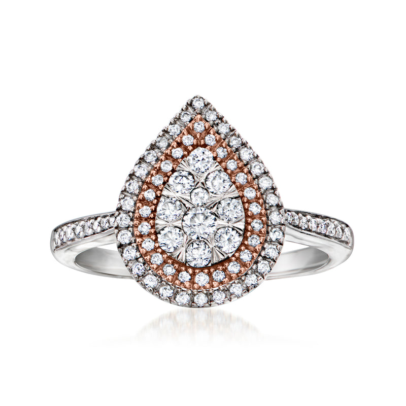 Two-tone gold diamond cluster ring with teardrop halo and round center stones