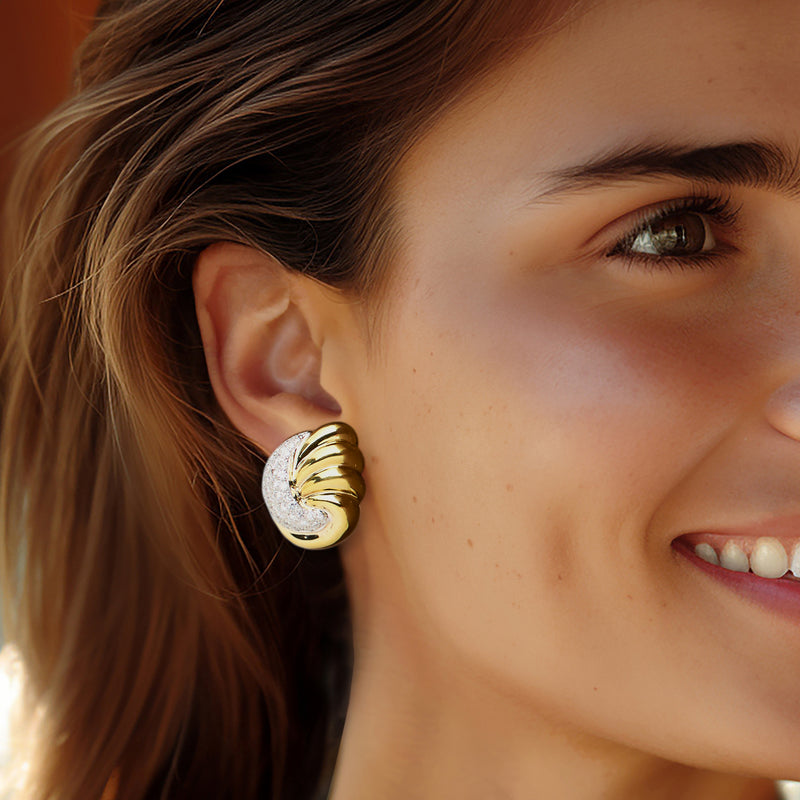 Diamond fan earrings in 14kt yellow gold worn on ear