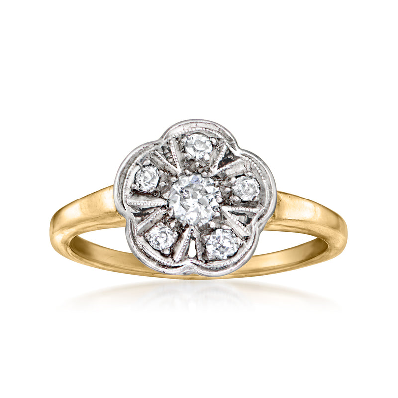 Two-tone gold diamond flower ring with round center stone and halo of small diamonds