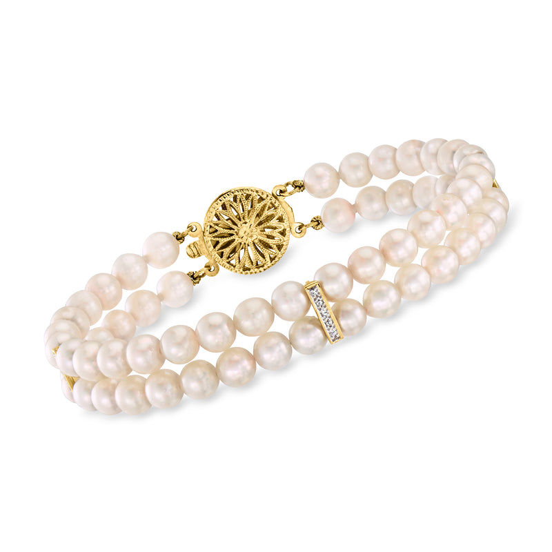 Two-row cultured pearl bracelet with 14kt yellow gold clasp and diamond accents.