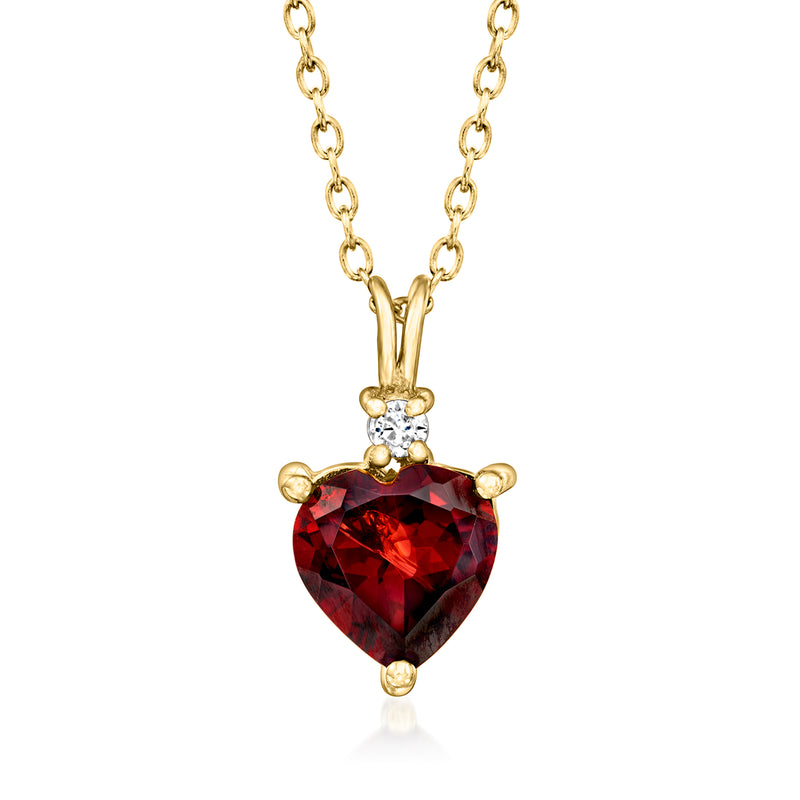 Gold heart pendant necklace with red garnet heart and small white zircon cluster