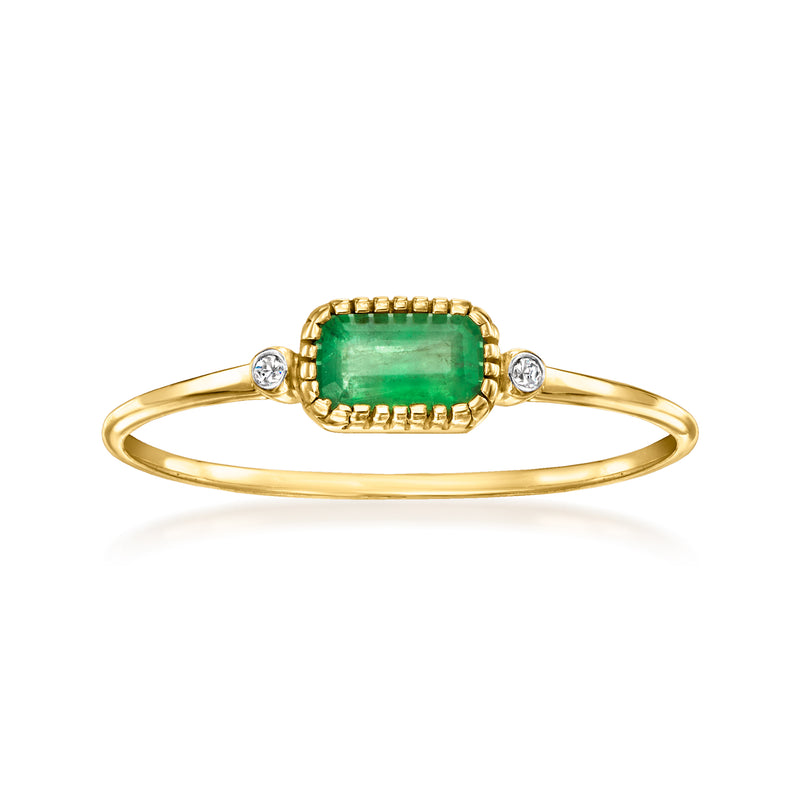 14k yellow gold emerald bezel ring with emerald-cut green stone and two diamond accents