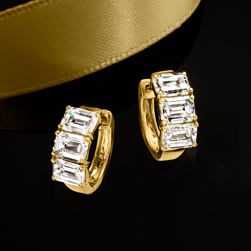 Yellow gold huggie hoop earrings with stacked emerald-cut diamond bars