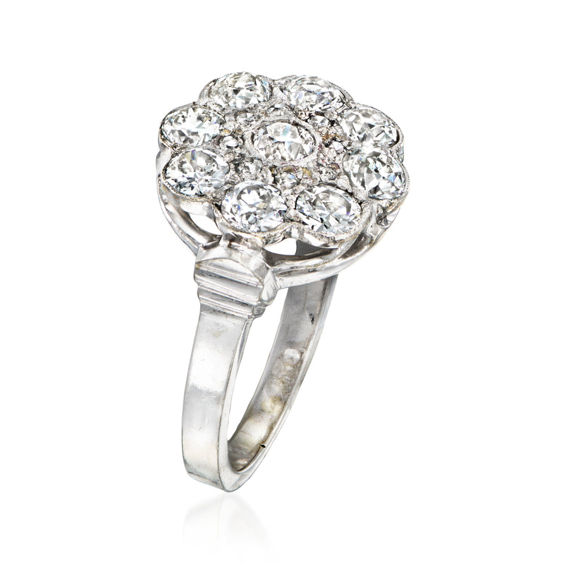Diamond flower cluster ring with sparkling stones, 14kt white gold band, side view.