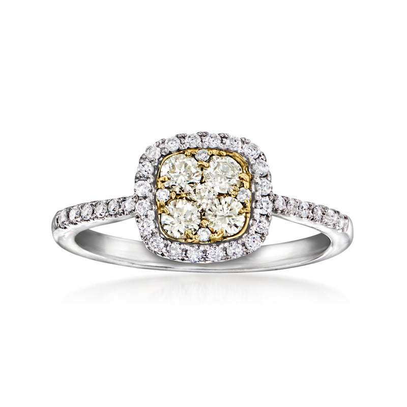 Two-tone diamond cluster ring with oval center stone and round halo in white gold