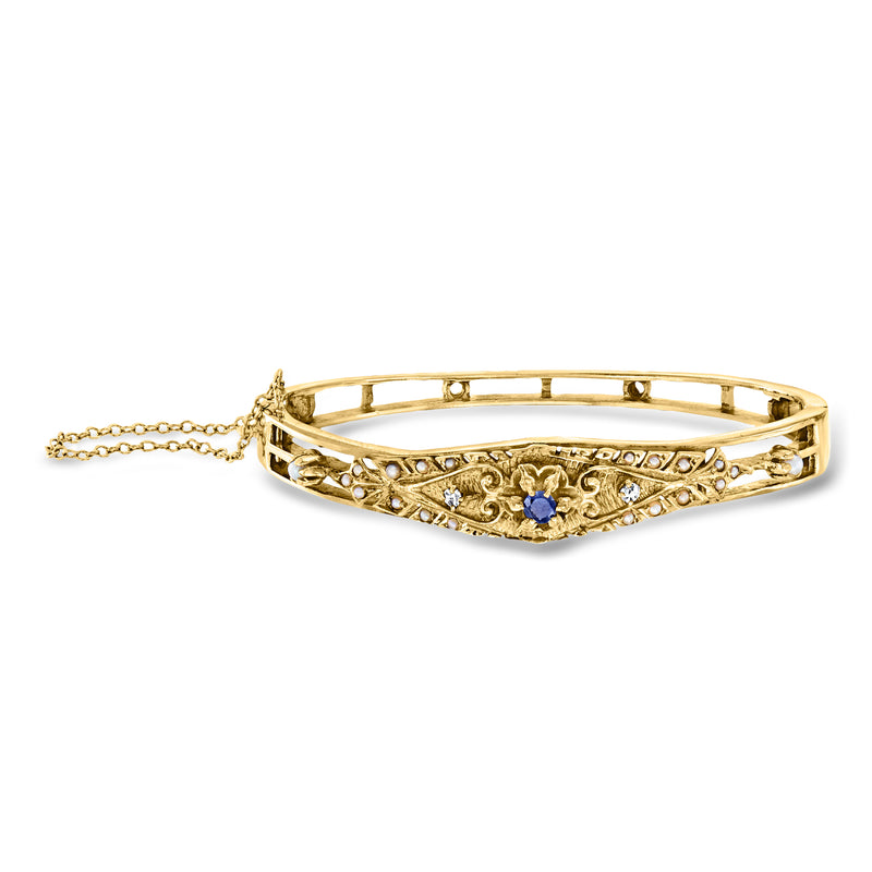 14k yellow gold bangle bracelet with blue sapphire center and diamond accents
