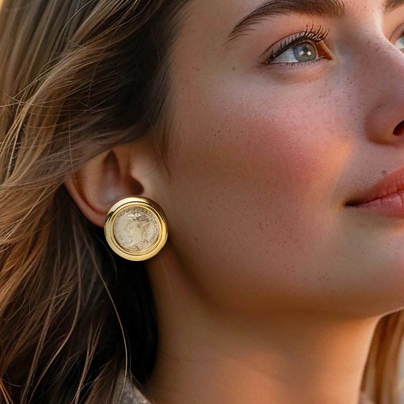 Gold Roman coin stud earrings on model, round bezel with engraved profile