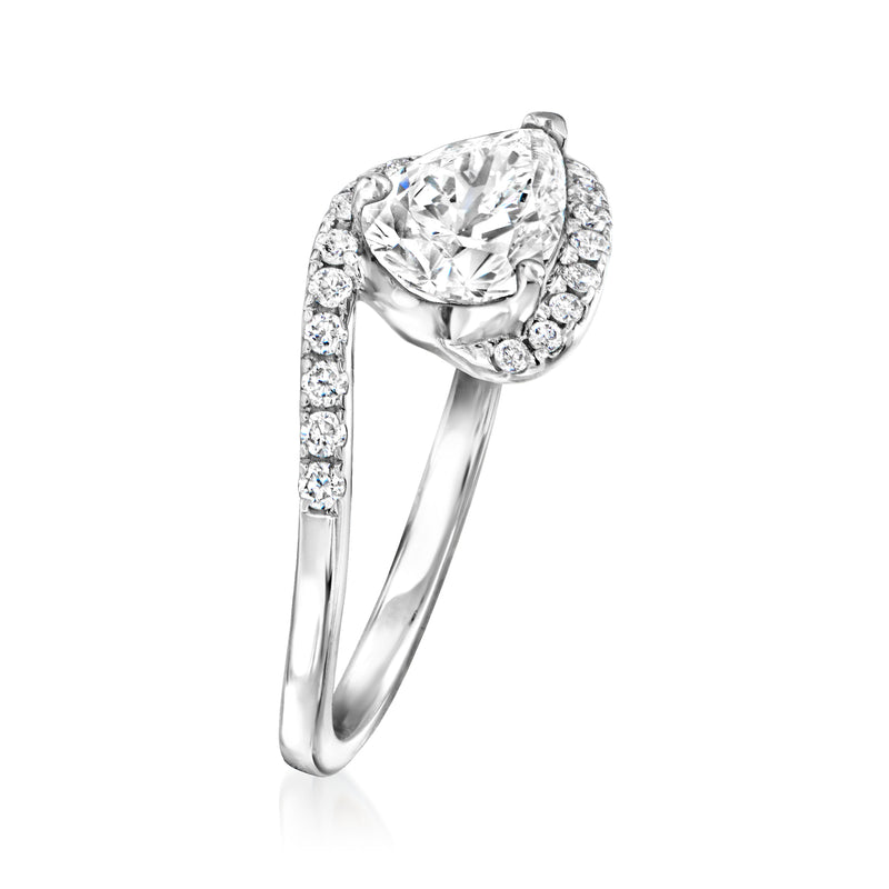 Asymmetrical lab-grown diamond ring in 14kt white gold, oval center with pave halo