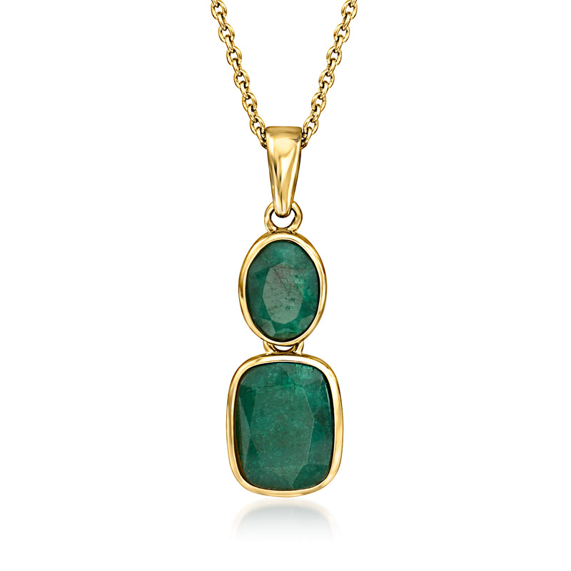 Gold pendant necklace with two green oval gemstones in oval settings