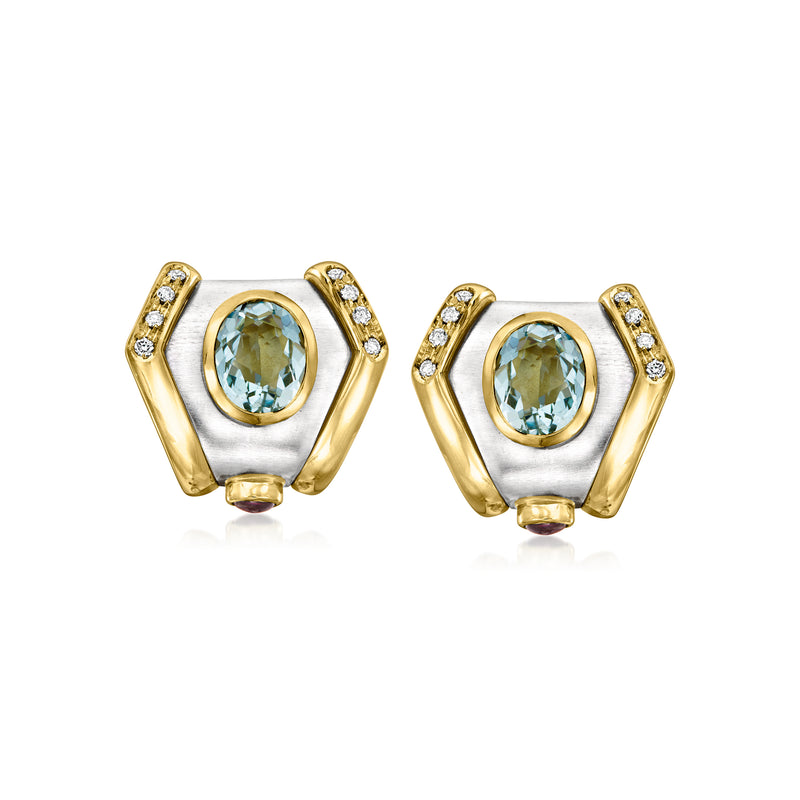 Two-tone gold geometric earrings with oval blue topaz center and diamond accents