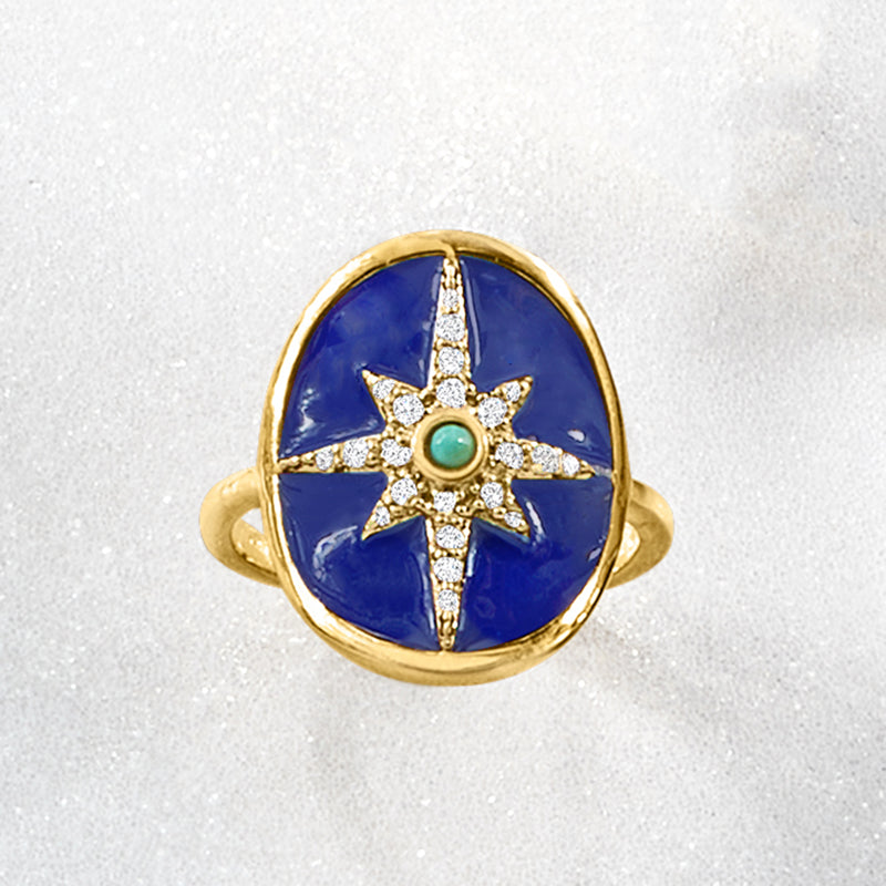 Gold-tone blue enamel oval ring with turquoise center star and white zircon details