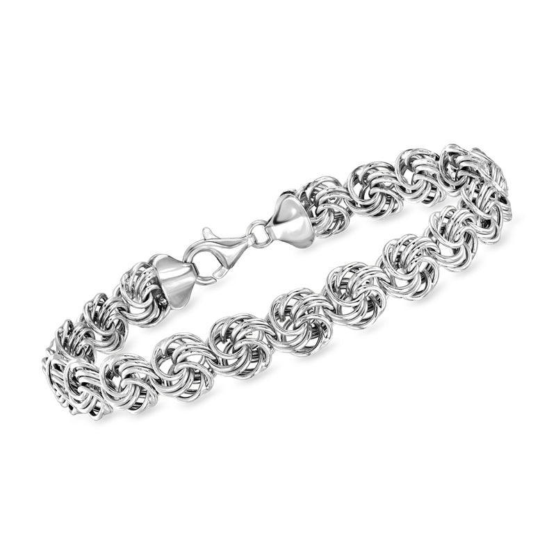Sterling silver rosette-link bracelet with polished chain links and toggle clasp